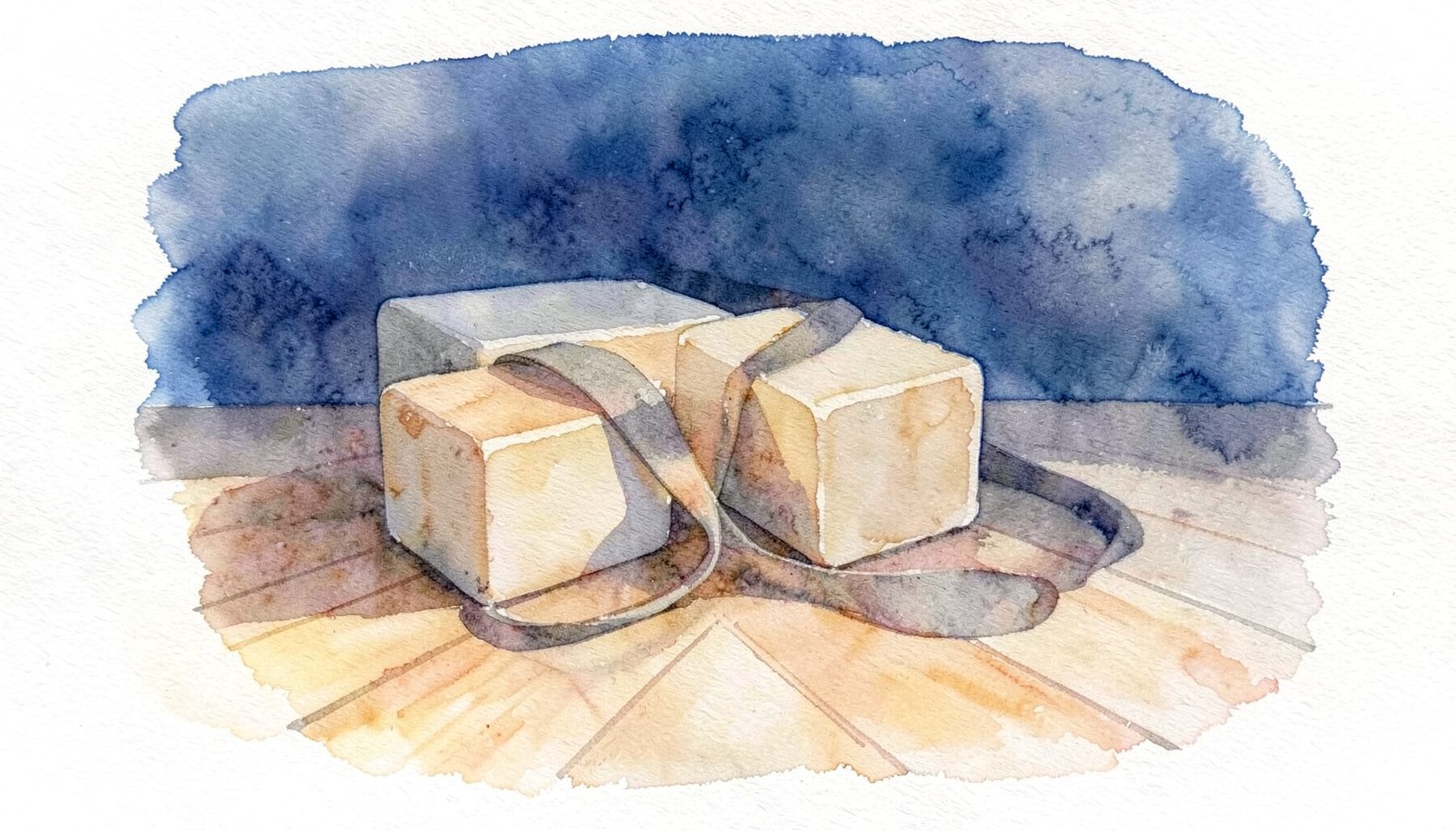 Soft watercolour painting of yoga blocks and a strap resting on a wooden floor, warm amber and soft grey tones, simple and inviting